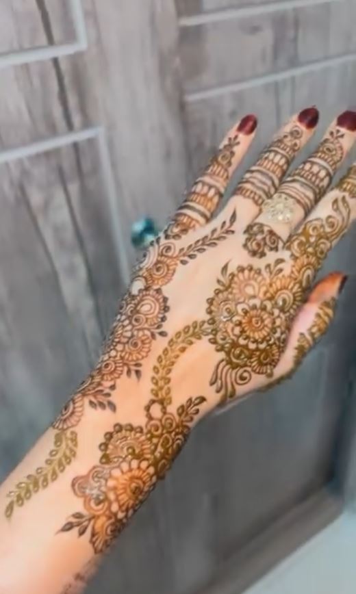 Intricate henna hand design