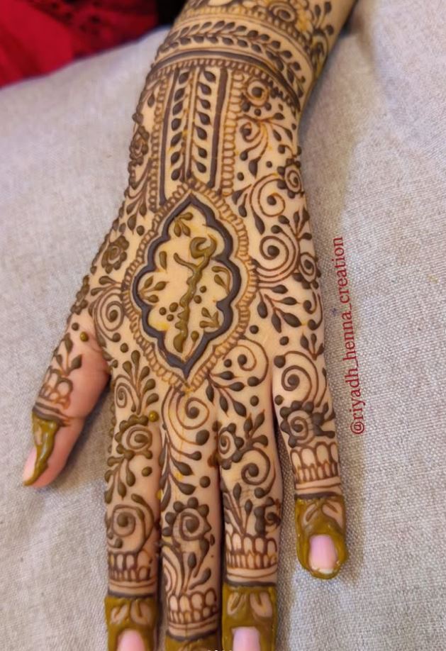 Floral henna pattern on hand