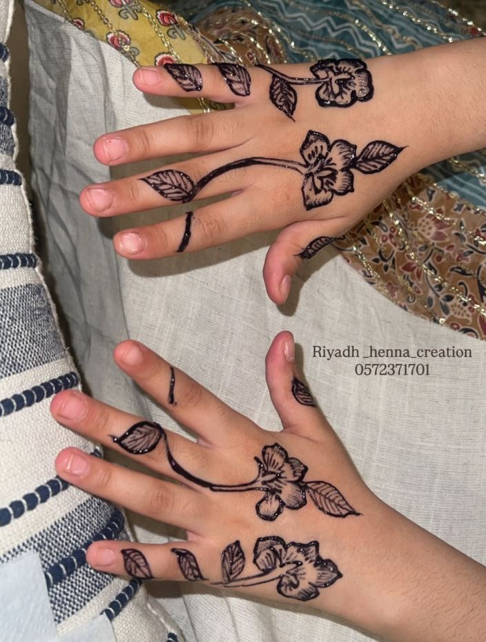 Simple floral henna on children's hands
